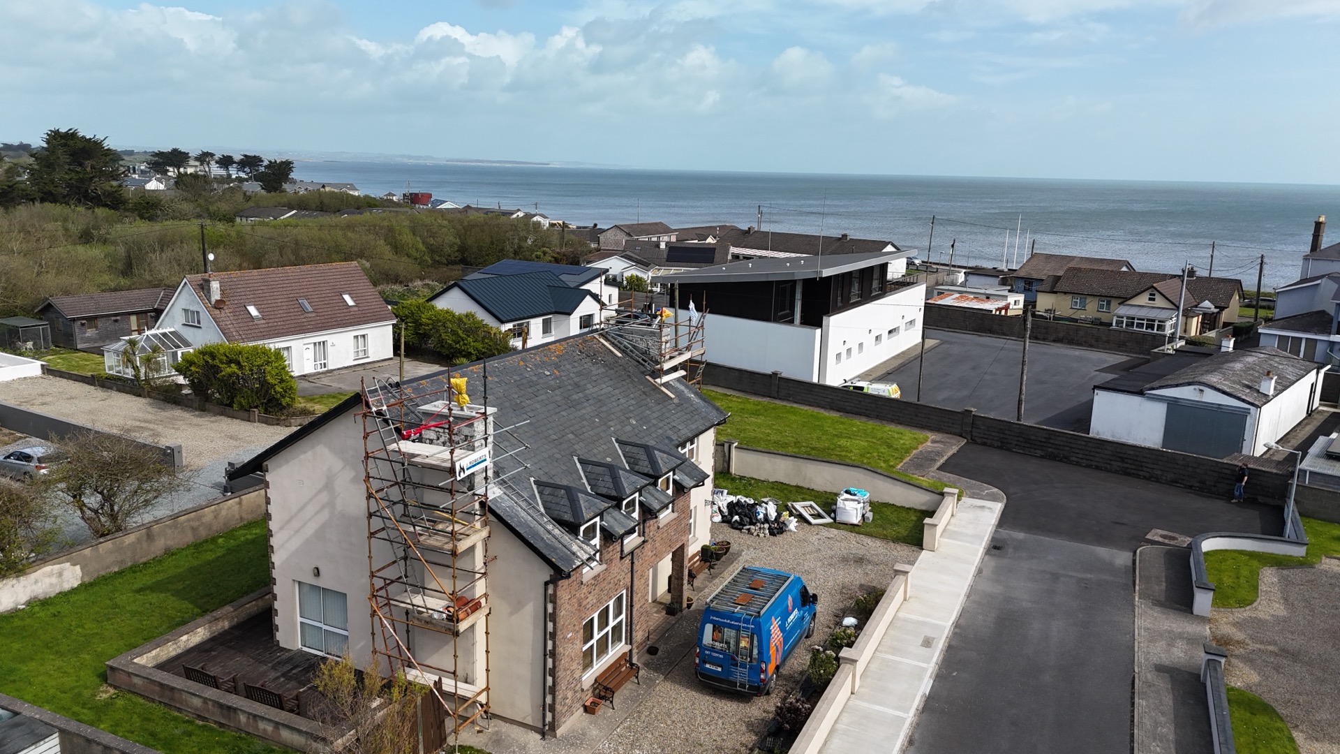 Aerial view of chimney repair with sea