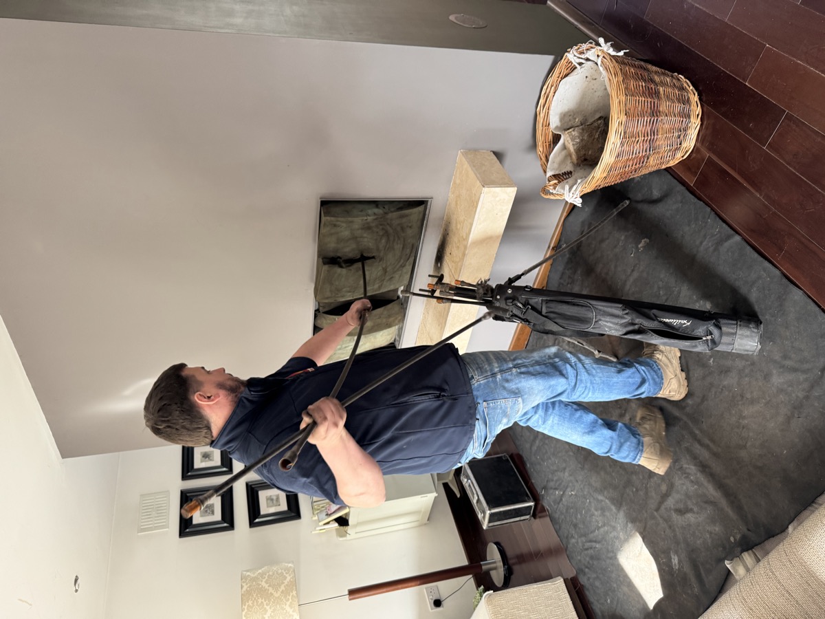 Jonathon Roberts sweeping a chimney in Carlow