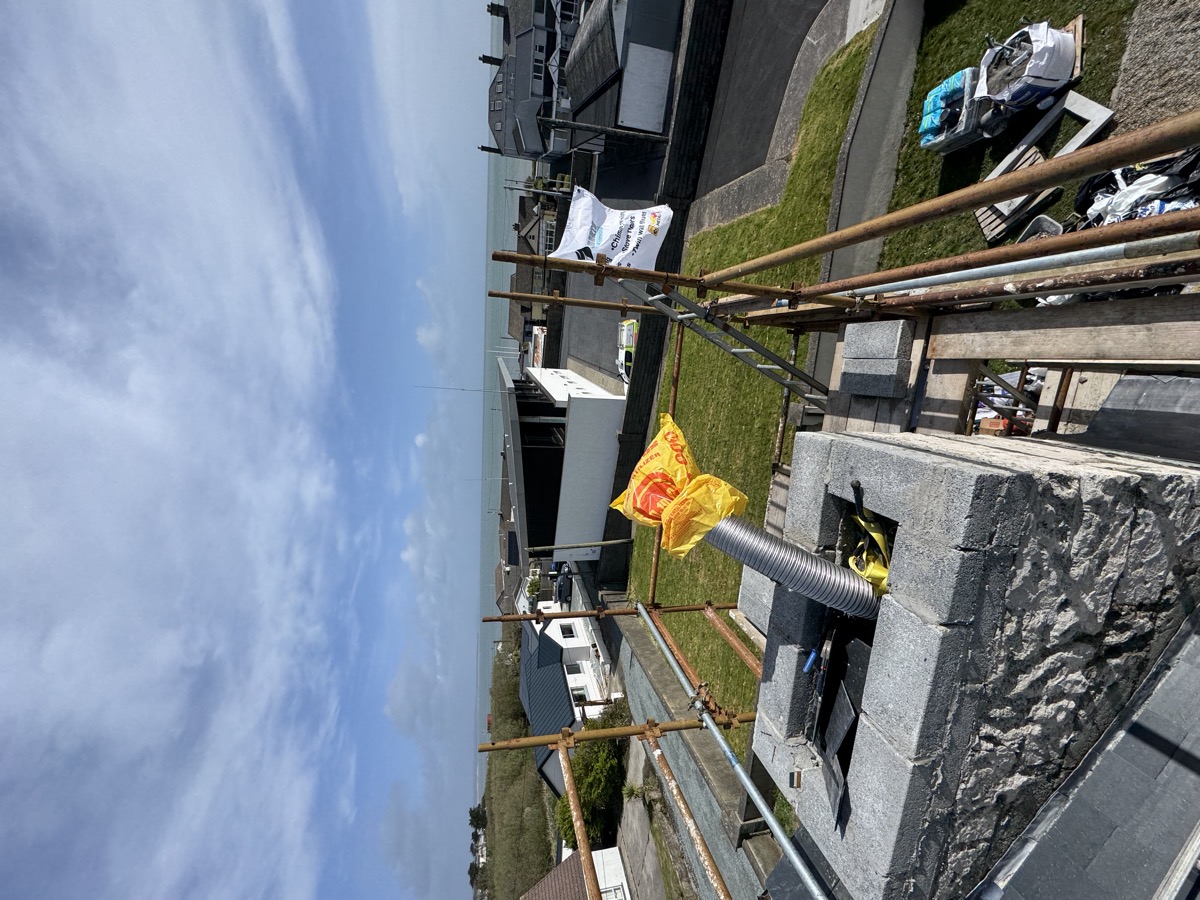 Hoist and scaffolding at chimney