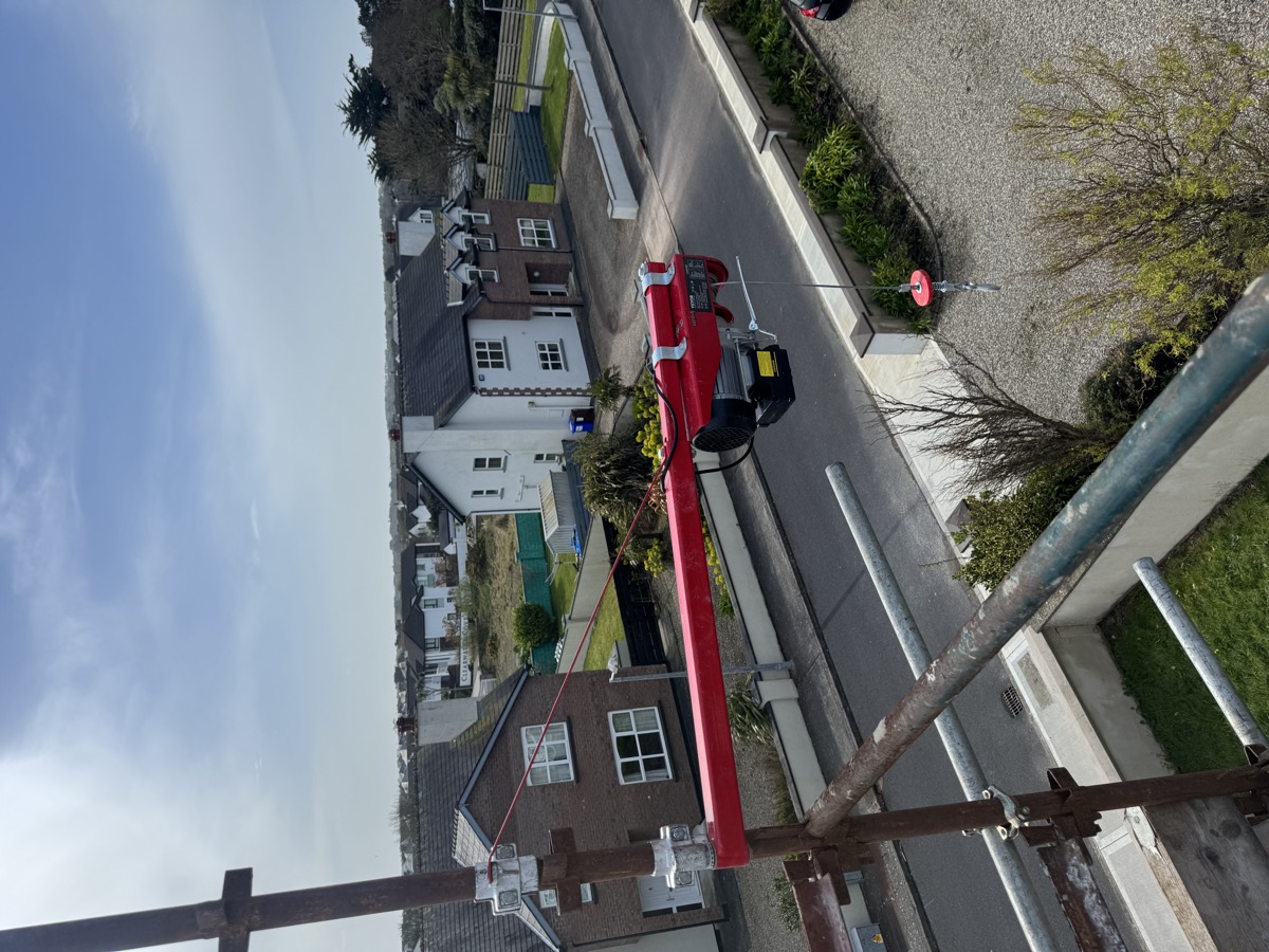 Material hoist for chimney repair